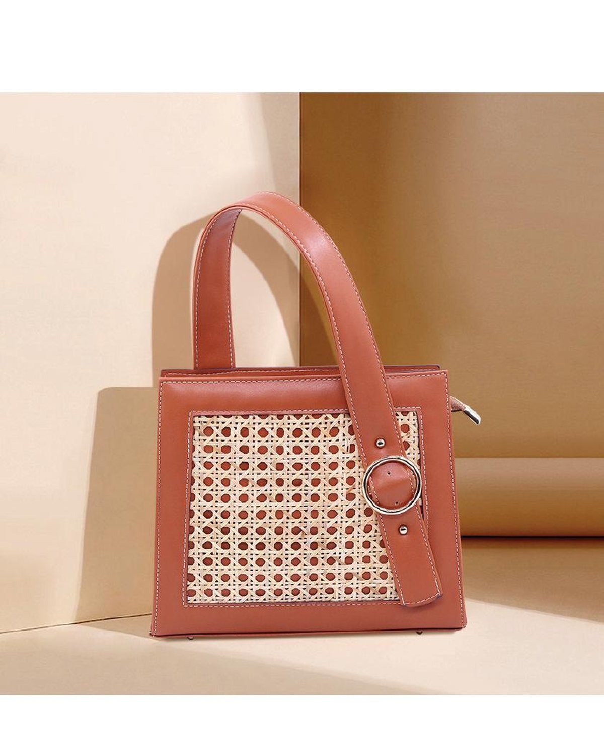 Structured woven straw handbag with coral leather trim